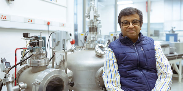 Professor Somnath Bhattacharyya next to the vapour deposition chamber that is used to produce diamonds in the lab.